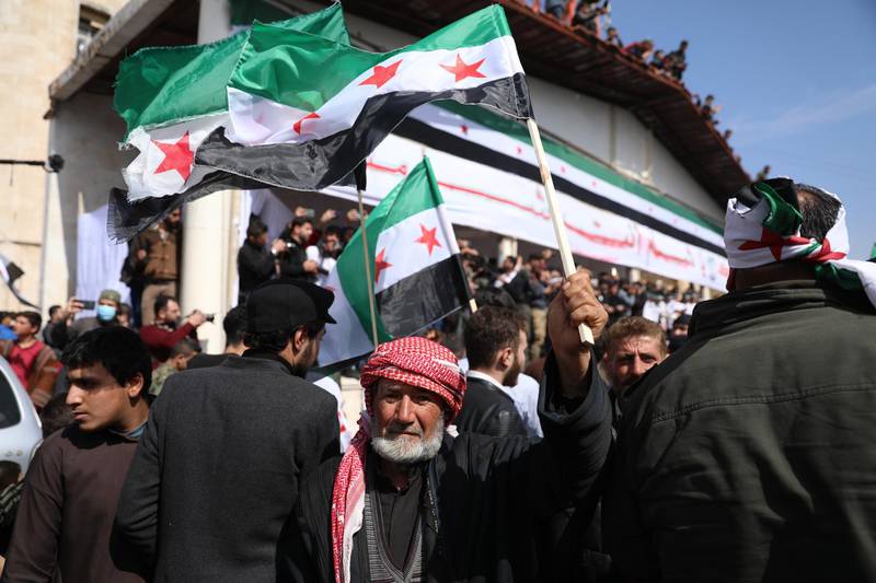 Syrians gather to commemorate the ten years anniversary of the uprising against the Syrian government, in Idlib. EPA