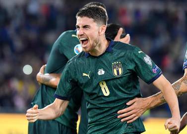 Italy midfielder Jorginho celebrates after scoring the first goal against Greece from the penalty spot. EPA
