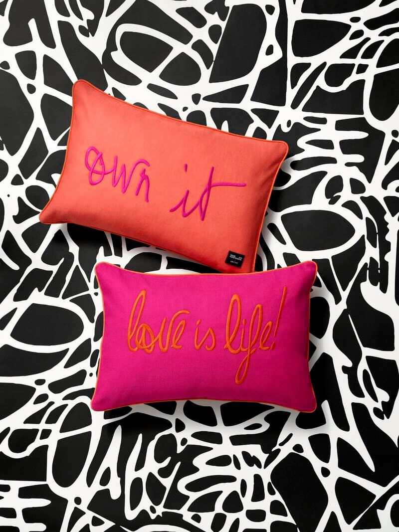 Uplifting messages appear on cushion covers and wall prints. Courtesy H&M