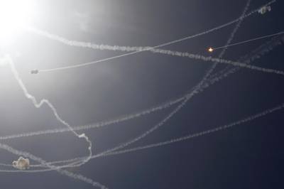 Smoke trails are seen as Israel's Iron Dome anti-missile system intercepts rockets launched from the Gaza Strip, as seen from Ashkelon. Reuters