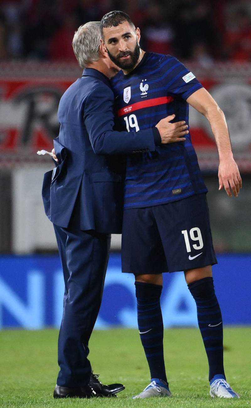 Karim Benzema hugs France manager Didier Deschamps after the Nations League game against Austria in June 2022. AFP