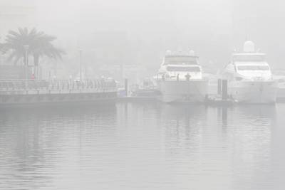 DUBAI, UNITED ARAB EMIRATES. 24 DECEMBER 2017. Heavy morning fog envelopes the city. The Marina covered in thick fog. (Photo: Antonie Robertson/The National) Journalist: None. Section: National.