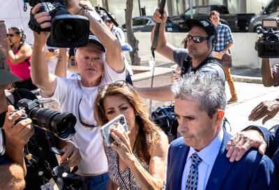 Carlos De Oliveira, right, a property manager at Donald Trump's resort Mar-a-Lago, enters a hearing in Miami, Florida, accused of helping move classified information, lying and trying to destroy surveillance footage. EPA