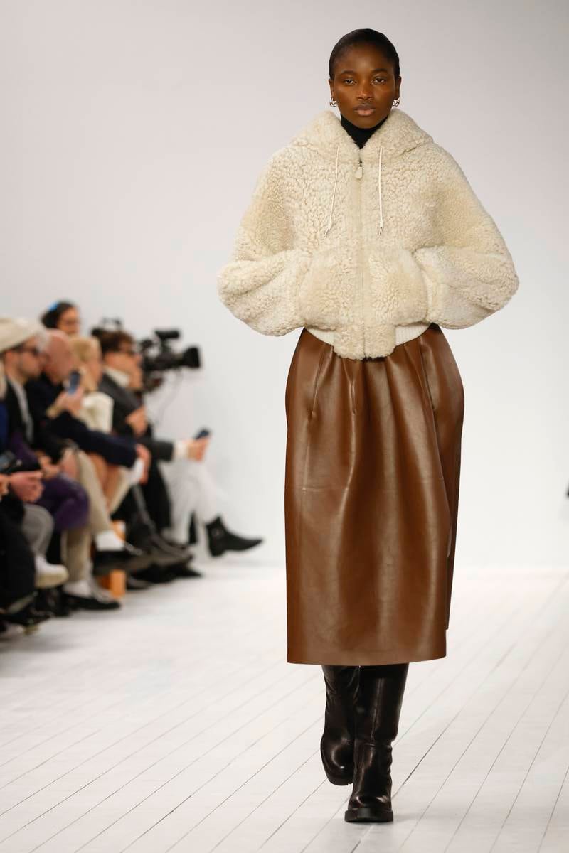 Cosy separates, such as this shearling bomber and leather tulip skirt at Chloe. EPA 