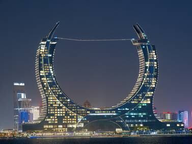 Watch Red Bull athlete set world record for longest LED-lit slackline walk in Qatar
