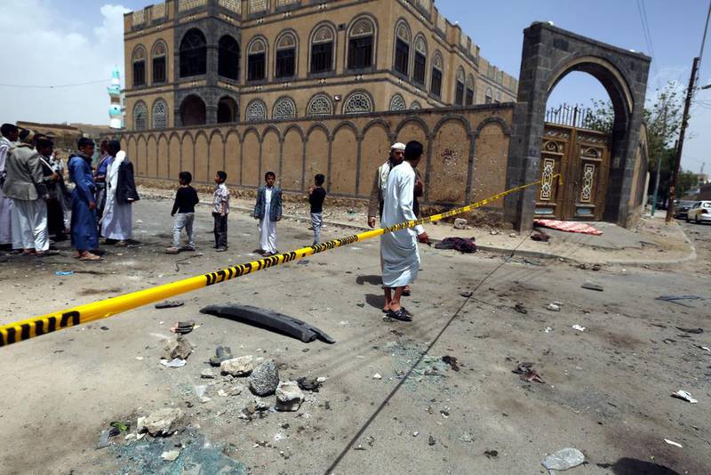 Yemenis and members of the Houthi militia inspect the scene of a suicide attack a day after it targeted a Houthi mosque in Sanaa. (Yahya Arhab / EPA)