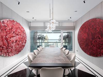 The formal dining room opens up to a spacious balcony. Courtesy Luxhabitat Sotheby's International Realty