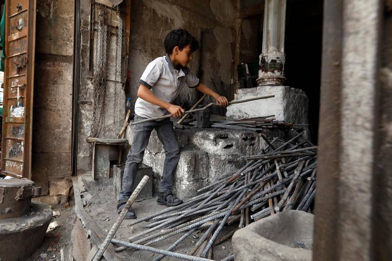 A boy working on World Day Against Child Labour, in Sanaa, Yemen. EPA