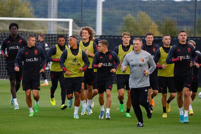 Belgian players attend their team's training session. EPA