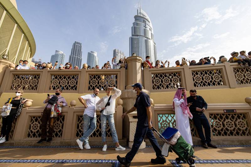 Tourists outside the The Dubai Mall. The emirate's tourism sector has maintained a strong performance in 2022, say analysts. Bloomberg