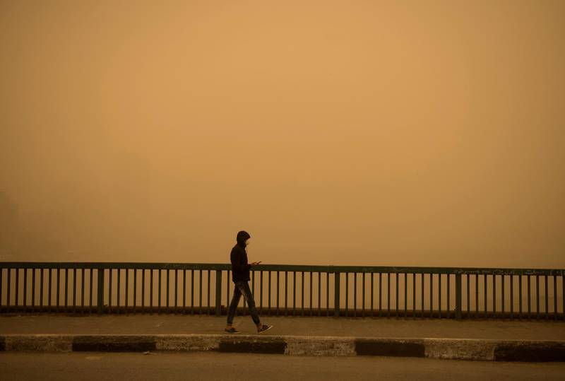 A man walks during a sandstorm in Cairo, Egypt. EPA