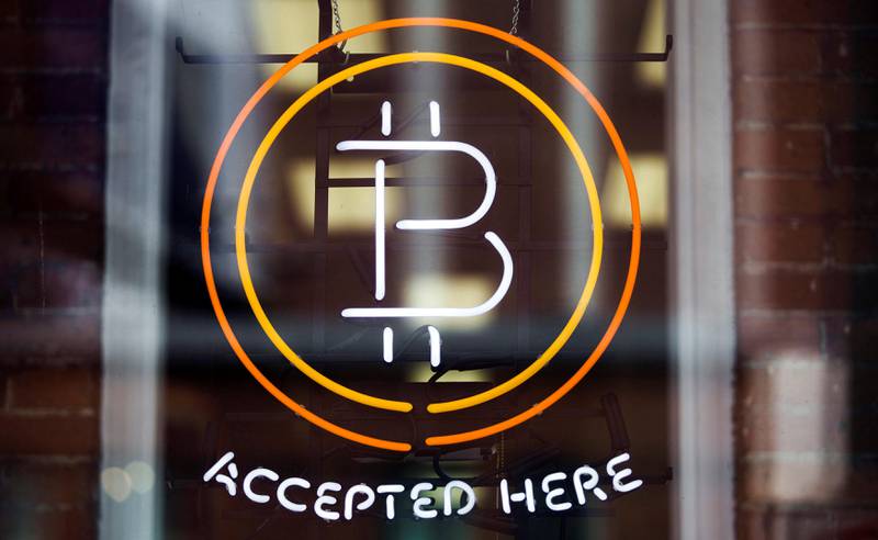 FILE PHOTO: A Bitcoin sign is seen in a window in Toronto, Canada, May 8, 2014.     To match Special Report BITCOIN-EXCHANGES/RISKS      REUTERS/Mark Blinch/File Photo