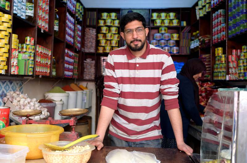 Tunisian grocer Bilel Jani sees the reality of a biting economic crisis.