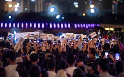 Fans wait for the K-pop artist to take to the Dubai Festival City stage.  