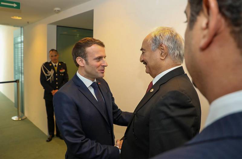 Field Marshall Khalifa Haftar greeting with French President Emmanuel Macron (C) in the German capital Berlin. AFP