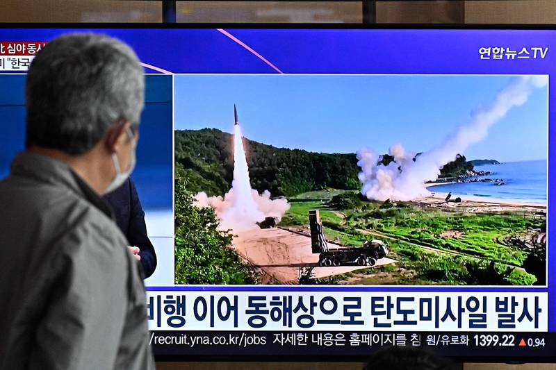 A man watches a news broadcast showing file footage of a North Korean missile test, at a railway station in Seoul on Friday. AFP