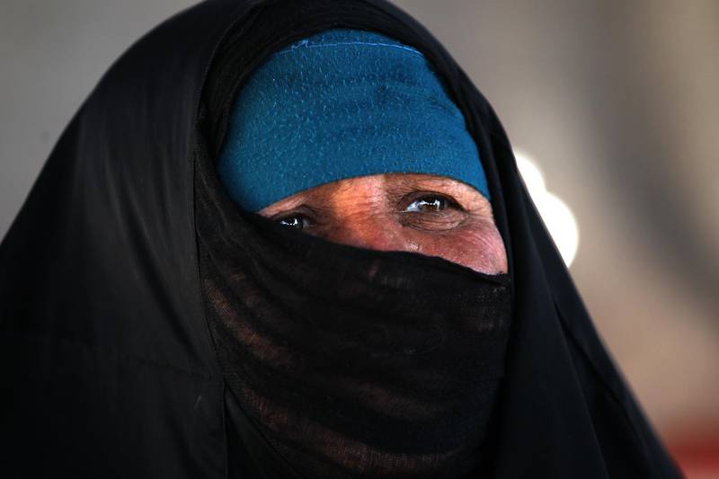 A displaced Iraqi woman looks on in a camp for internally displaced people near al-Khalidiyeh in Iraq's western Anbar province.While the election campaign is in full swing elsewhere in Iraq, the country's displaced camps barely register on the radars of those running for office, despite housing hundreds of thousands of people. Ahmad Al Rubaye / AFP
