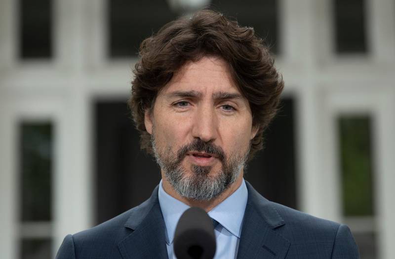 Canadian Prime Minister Justin Trudeau responds to a question on racism during a news conference outside Rideau Cottage in Ottawa. Mr Trudeau said Canadians were watching what’s unfolding in the US with 'horror and consternation'.  AP