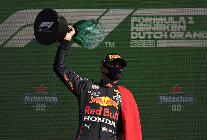 Race winner Max Verstappen celebrates on the podium. Getty