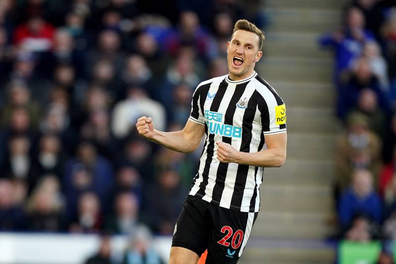 Newcastle striker Chris Wood celebrates scoring the opening goal from the penalty spot. PA