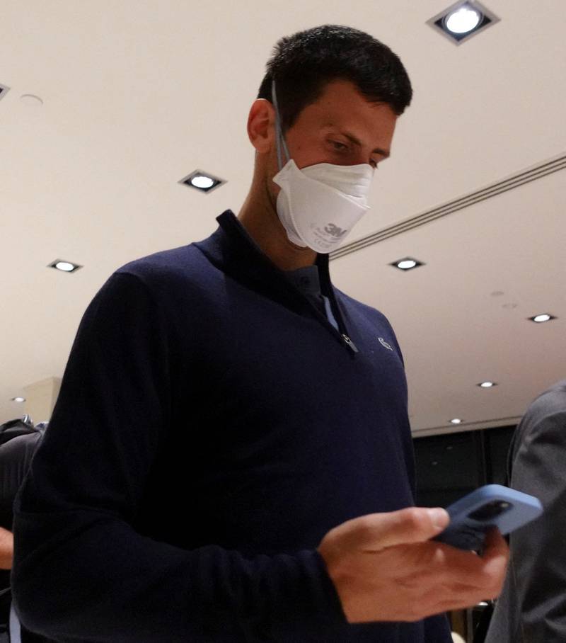 Serbian tennis player Novak Djokovic walks in Melbourne Airport before boarding a flight to Dubai. Reuters