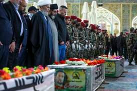 Mourners attend the funeral of Kataib Hezbollah members who were killed in US air strikes, in Najaf, Iraq. AP