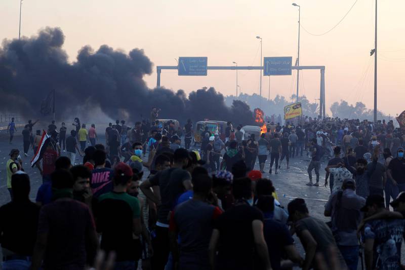 Demonstrators gather at a protest after the lifting of the curfew in Baghdad, Iraq. Reuters