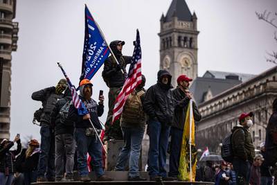 WASHINGTON, DC - JANUARY 05: Supporters of President Donald Trump gather for a rally at Freedom Plaza on January 5, 2021 in Washington, DC. Today's rally kicks off two days of pro-Trump events fueled by President Trump's continued claims of election fraud and a last ditch effort to overturn the results before Congress finalizes them on January 6. Gun laws in the District are extremely tight and further restrictions have been put in place within 100ft of first amendment events.   Samuel Corum/Getty Images/AFP
== FOR NEWSPAPERS, INTERNET, TELCOS & TELEVISION USE ONLY ==
