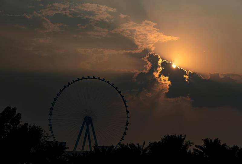 Dubai, United Arab Emirates - Reporter: N/A. News. Weather. The sun sets behind the Ain Dubai big wheel after the rain came down. Sunday, November 8th, 2020. Dubai. Chris Whiteoak / The National