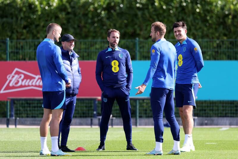 England manager Gareth Southgate speaks to Harry Kane and Harry Maguire. Getty
