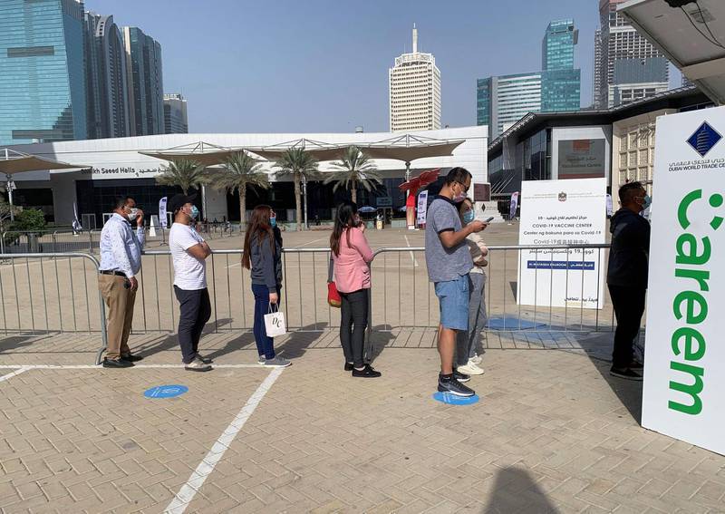 People queue for the vaccine near DIFC. The city has approved Pfizer-BioNTech, Sinopharm and Oxfrd-AstraZeneca for use, and officials hope to have half the population vaccinated by late March. AFP