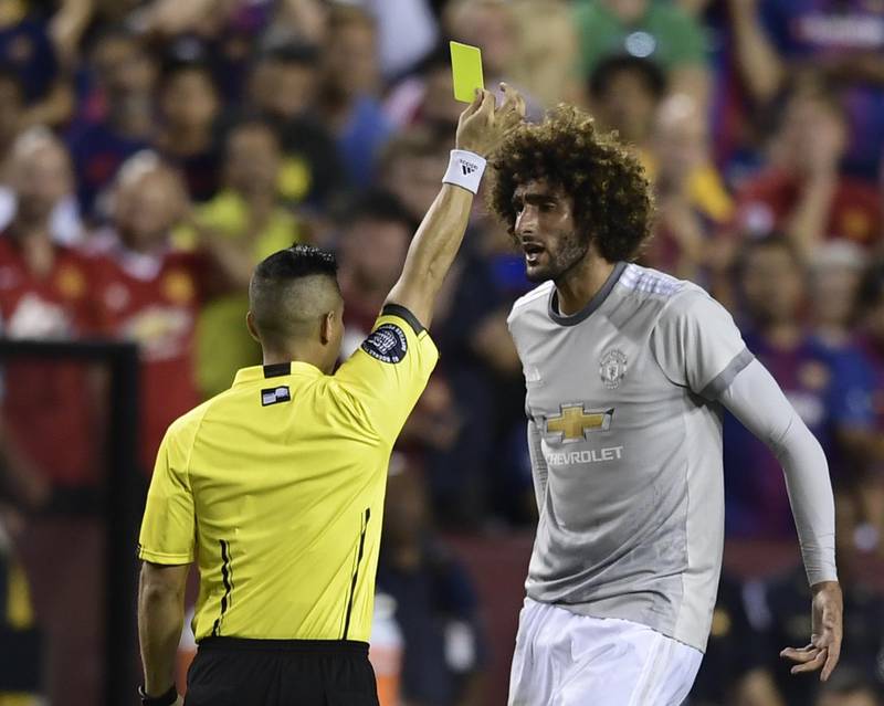 Marouane Fellaini of Manchester United is given a yellow card during their International Champions Cup (ICC) football match against Barcelona on July 26, 2017 at the FedExField, in Landover, Maryland. Brendan Smialowski / AFP