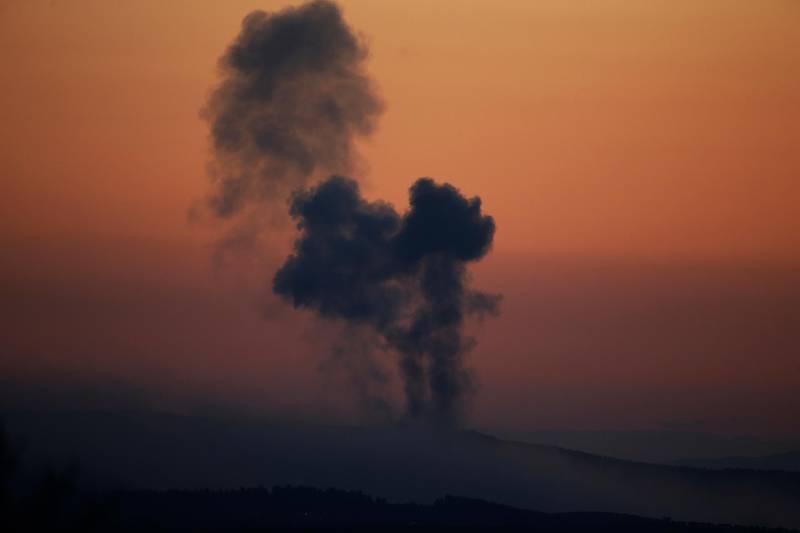 FILE - In this Saturday, Jan. 20, 2018 file photo, plumes of smoke rise on the air from inside Syria, as seen from the outskirts of the border town of Kilis, Turkey. Turkeyâ€™s military offensive on the Syrian border town of Afrin, controlled by Kurdish fighters, has been long in coming. Turkish officials have been threatening to launch the offensive and preparing for it for months. But there have been shades of gray in Ankaraâ€™s professed goals about the military incursion, which was launched on Saturday. (AP Photo/Lefteris Pitarakis, File)