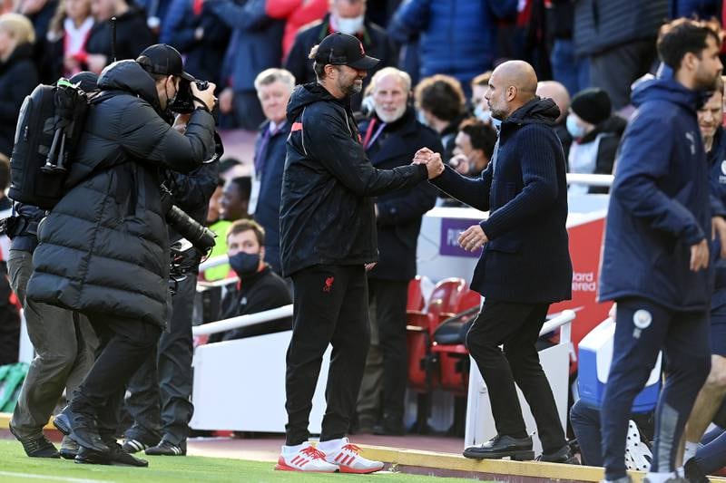 Liverpool manager Jurgen Klopp shakes hands with his City counterpart Pep Guardiola before the game. Getty