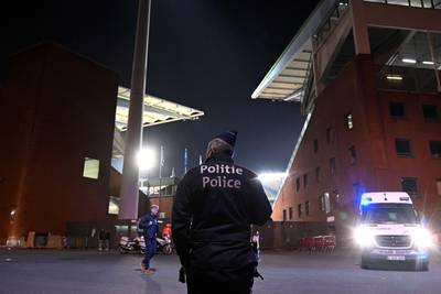 A police officer stands guard outside the King Baudouin Stadium after two people were shot dead in Brussels before a Euro 2024 qualifier between Belgium and Sweden. AFP