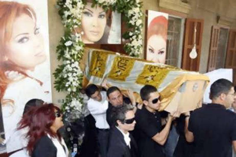 Relatives of murdered Lebanese singer Suzan Tamim carry her coffin during her funeral in Beirut on Aug 4.