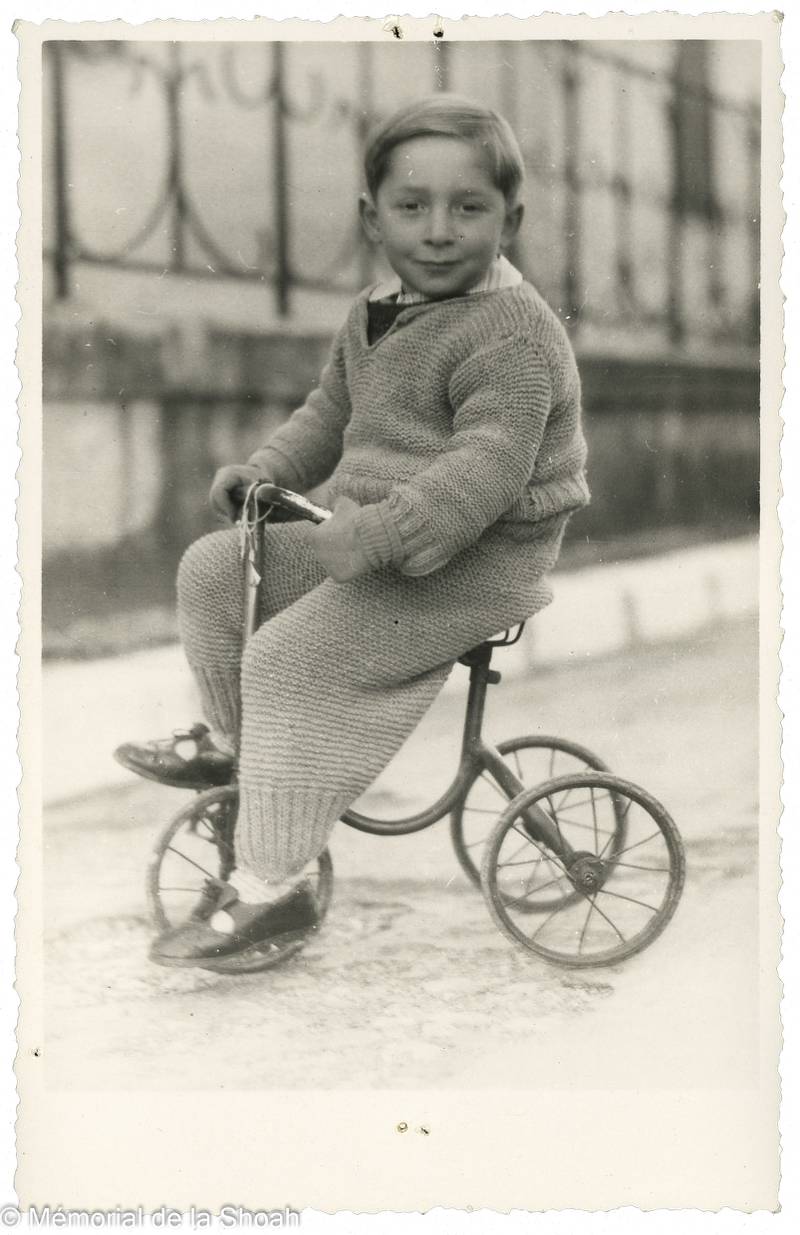 Pierre Halpern, hidden by the Marcel Network, sits on a bike in France in 1943 or 1944. Memorial de la Shoah/Coll.Odette Abadi