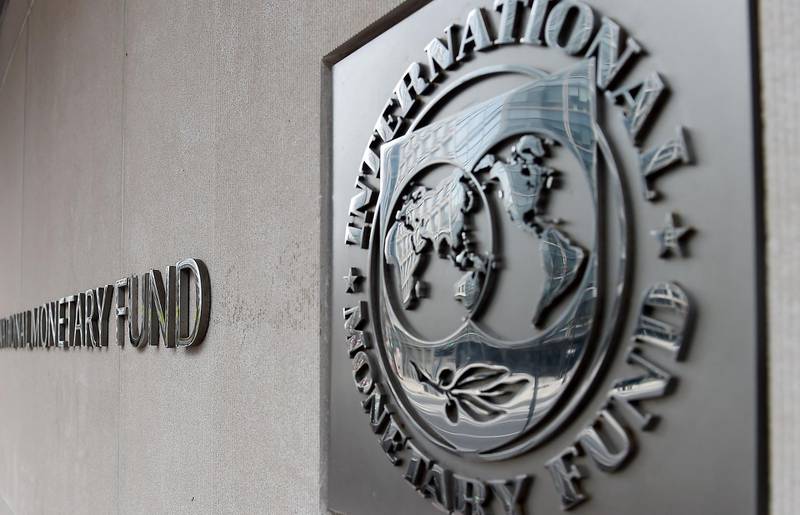 An exterior view of the building of the International Monetary Fund (IMF), with the IMG logo, is seen on March 27, 2020 in Washington, DC.  The coronavirus pandemic has driven the global economy into a downturn that will require massive funding to help developing nations, IMF chief Kristalina Georgieva said on March 27, 2020. / AFP / Olivier DOULIERY
