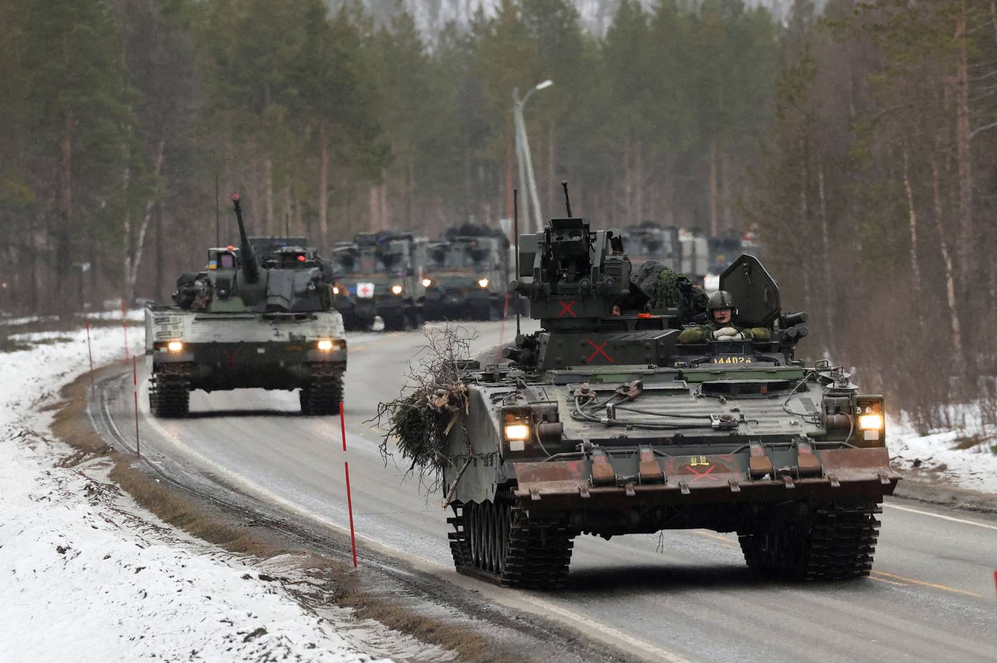 Swedish Army armoured vehicles and tanks participate in a military exercise called "Cold Response 2022", gathering around 30,000 troops from NATO member countries as well as Finland and Sweden, in Setermoen in the Arctic Circle, Norway. Reuters