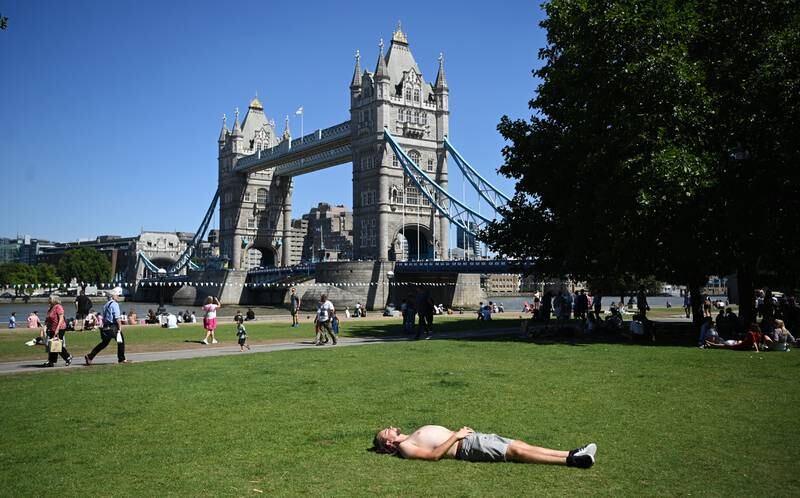A sunbather enjoys the warm weather in London. EPA