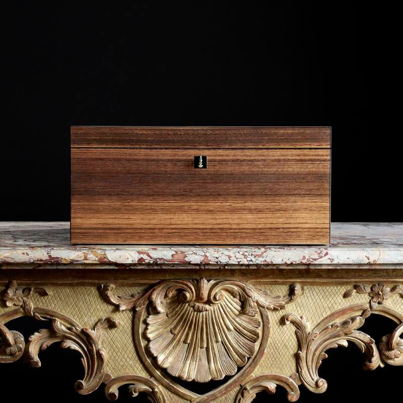 Each bag is presented in a lacquered eucalyptus wood coffer 