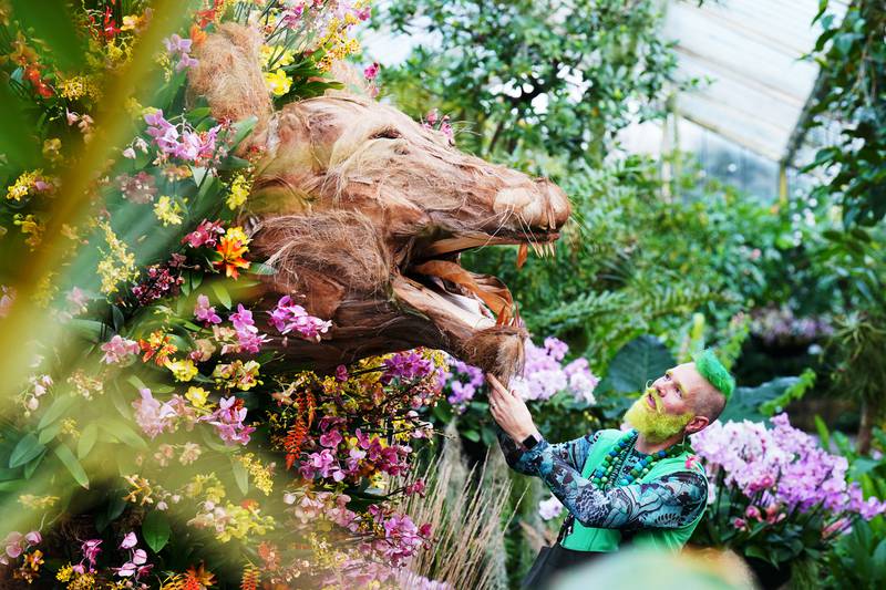 Horticulturist Henrick Roling with a lion-inspired display at the Cameroon-themed Orchid Festival at Kew Gardens on Thursday. PA