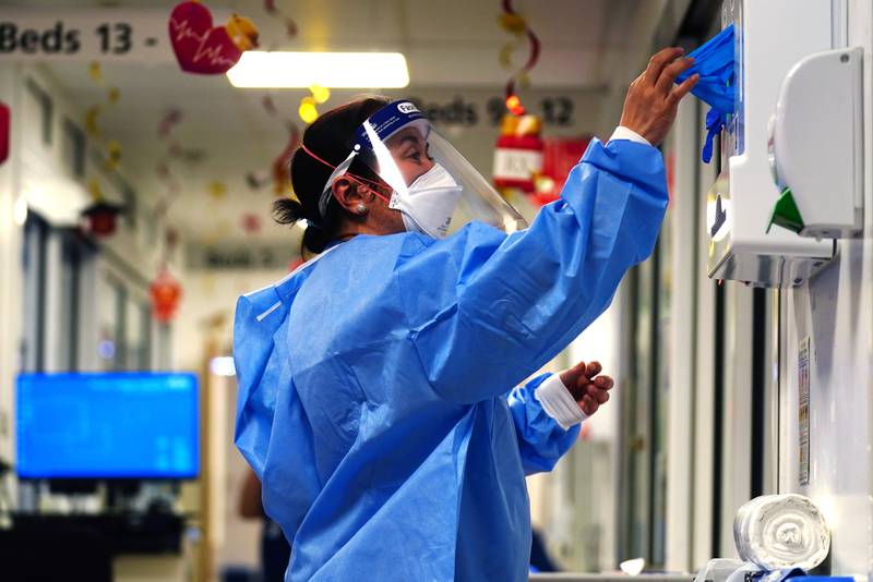 A nurse in PPE on a ward for Covid patients at King's College Hospital, in south-east London. PA