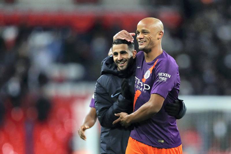LONDON, ENGLAND - OCTOBER 29:  Riyad Mahrez and Vincent Kompany of Manchester City celebrates victory following the Premier League match between Tottenham Hotspur and Manchester City at Wembley Stadium on October 29, 2018 in London, United Kingdom.  (Photo by Catherine Ivill/Getty Images)