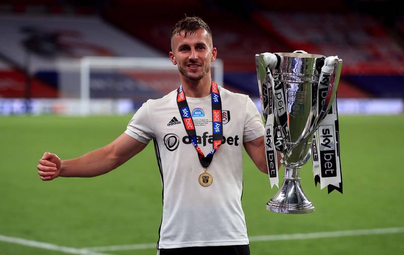Fulham’s Joe Bryan celebrates with the trophy. PA