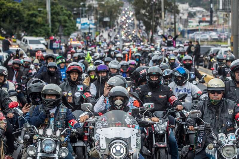 Motorcyclists participate in the so-called 'Caravana del Zorro' (Fox Caravan) in Guatemala City, Guatemala, 04 February 2023.  The Caravana del Zorro, one of the largest two-wheeled pilgrimages in the world, gathered 30,000 motorcycle riders in Guatemala City to undertake a 240-kilometer journey to the town of Esquipulas, as the event returned after a hiatus due to the coronavirus disease (COVID-19) pandemic.   EPA / Esteban Biba