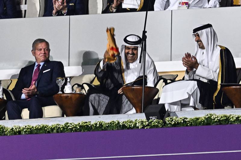 Qatar's former Emir Sheikh Hamad bin Khalifa Al Thani and Emir Sheikh Tamim bin Hamad Al Thani with King Abdullah II of Jordan during the opening game between Qatar and Ecuador. AFP