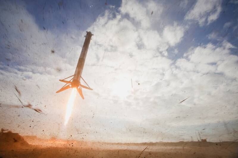 A SpaceX Falcon Heavy rocket side booster lands after being launched on a mission with a classified payload for the US  Space Force at Cape Canaveral, Florida. Reuters