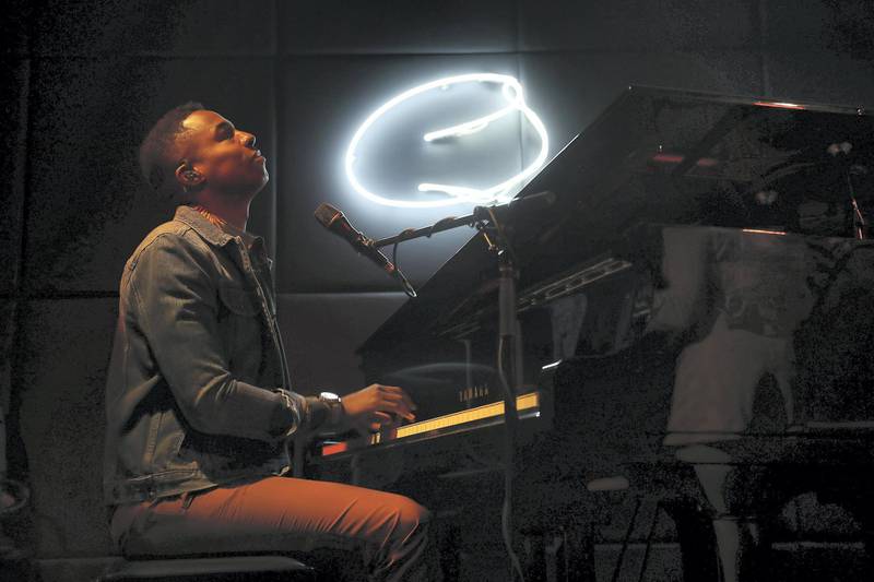 DUBAI , UNITED ARAB EMIRATES , April 5 – 2019 :- David Davis, The US pianist and singer performing with his band members at the Qs bar at the Palazzo Versace hotel in Dubai. ( Pawan Singh / The National ) For Arts and Life. Story by Saeed