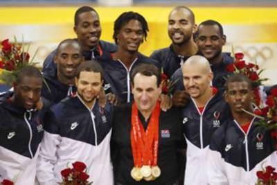 The USA head coach Mike Krzyzewski wears his players' gold medals after they defeated Spain in the men's basketball finals at the Beijing 2008 Olympic Games.